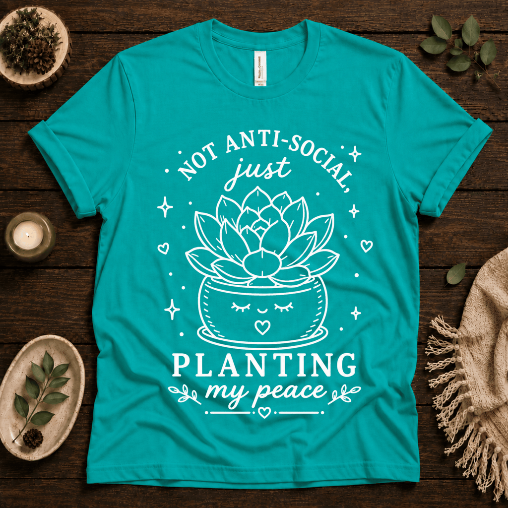 Planting My Peace cute plant graphic t-shirt cozy flat lay in heather sea green.
