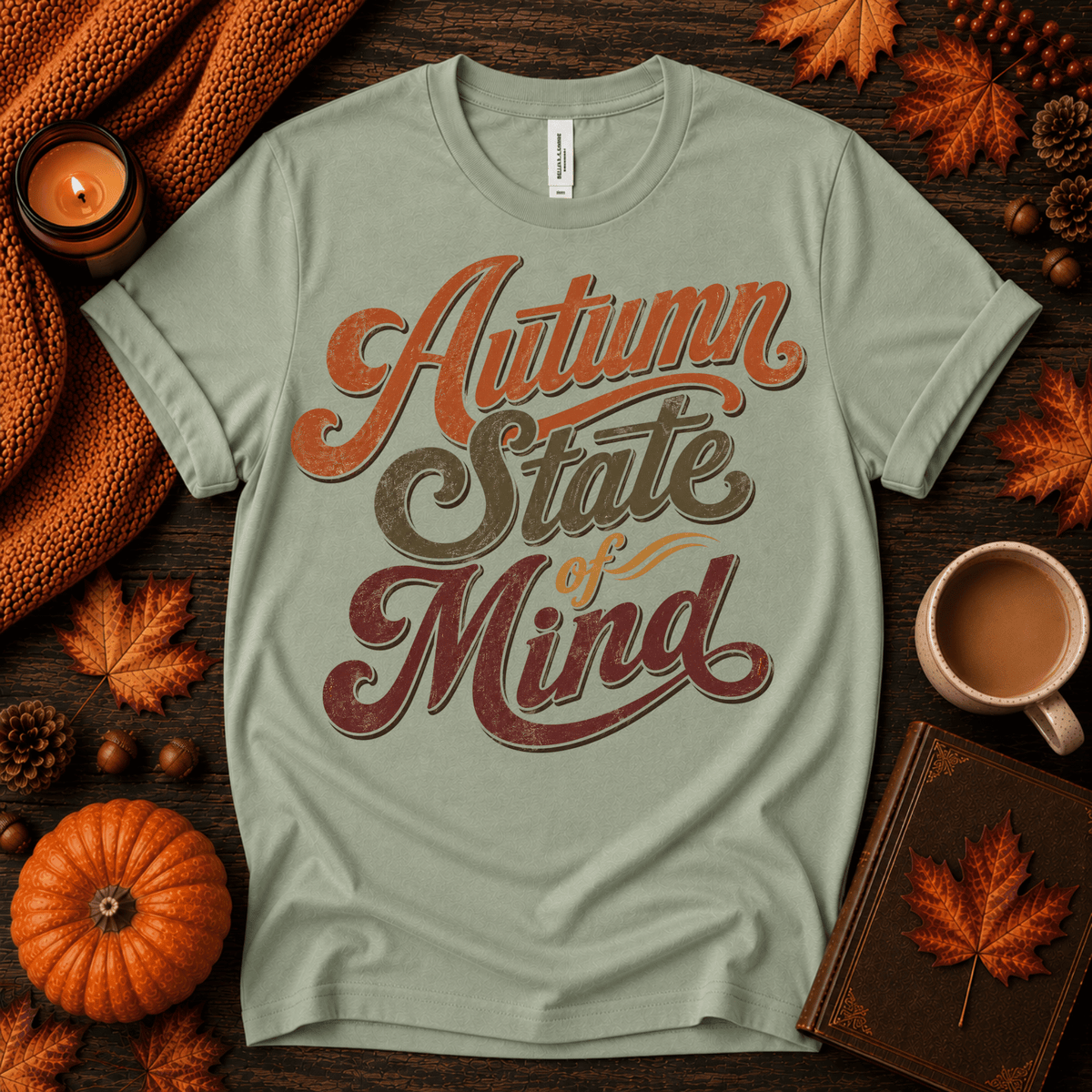 Autumn State of Mind cute fall graphic t-shirt cozy flat lay in sage.
