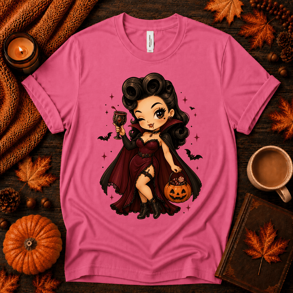 Vampire Vanessa halloween pinup graphic t-shirt cozy flat lay in charity pink.