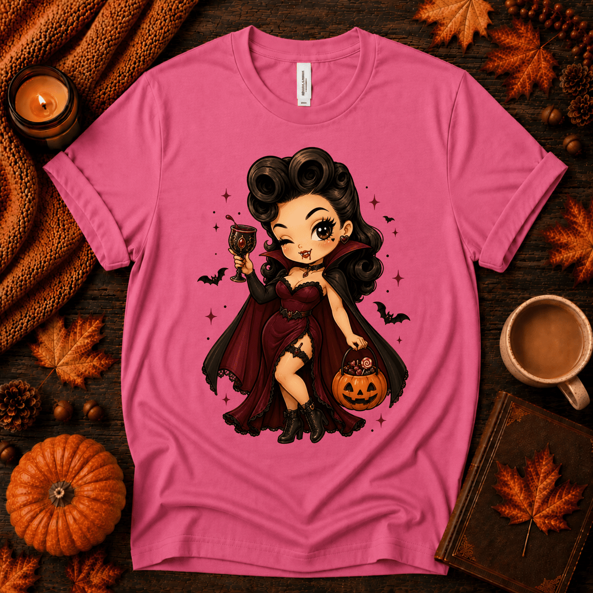 Vampire Vanessa halloween pinup graphic t-shirt cozy flat lay in charity pink.