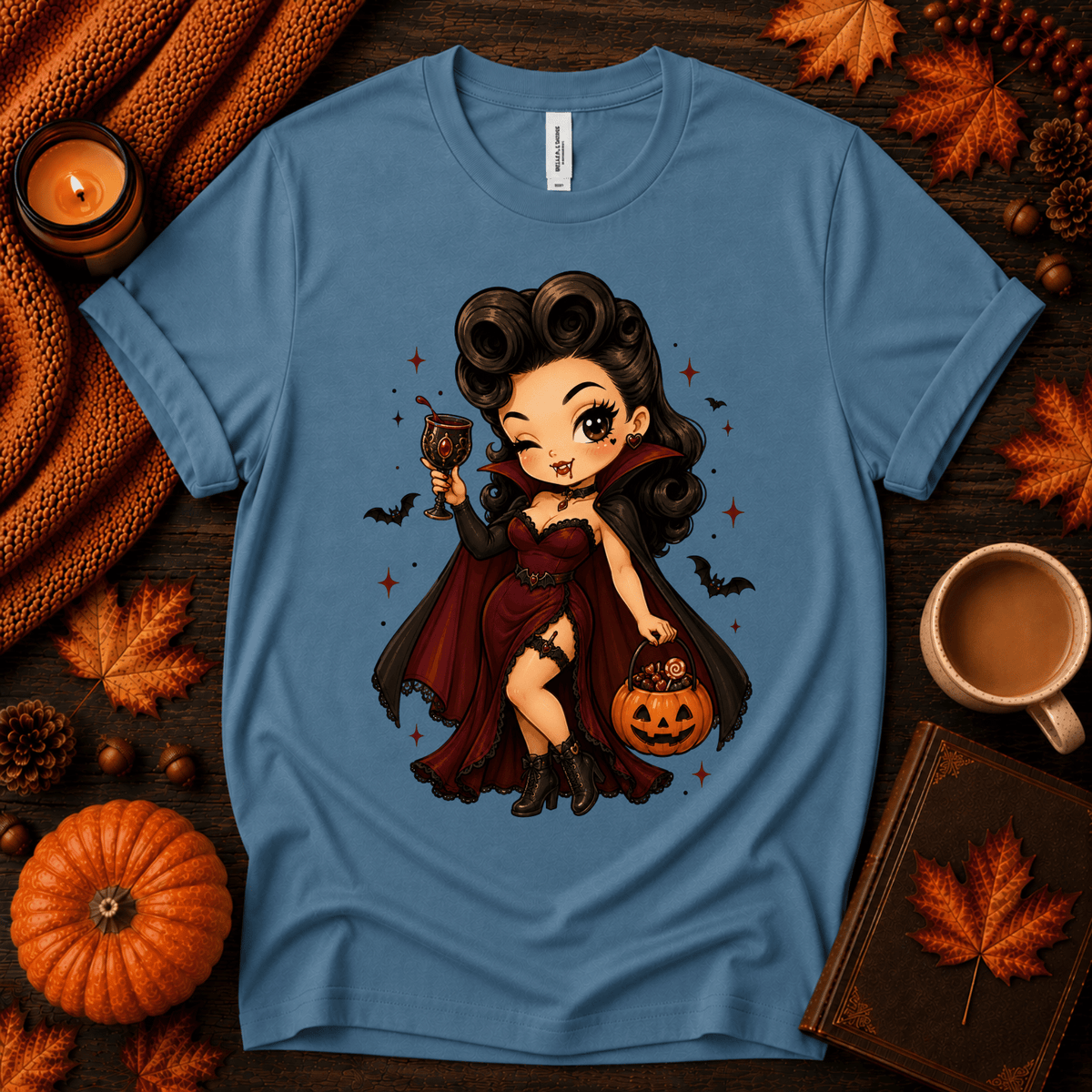 Vampire Vanessa halloween pinup graphic t-shirt cozy flat lay in steel blue.