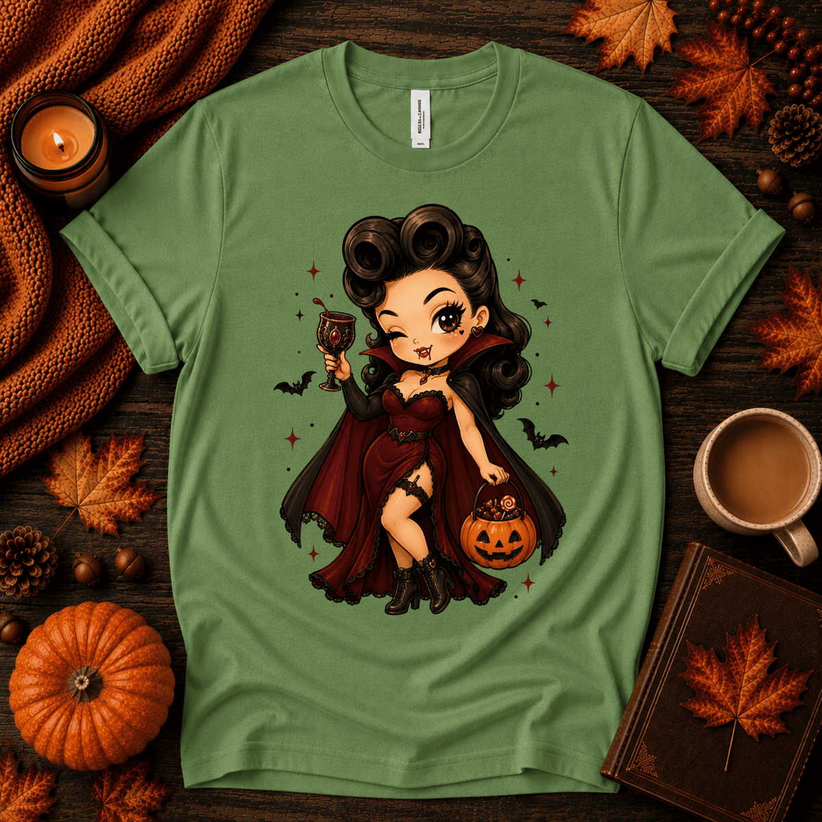Vampire Vanessa halloween pinup graphic t-shirt cozy flat lay in leaf.