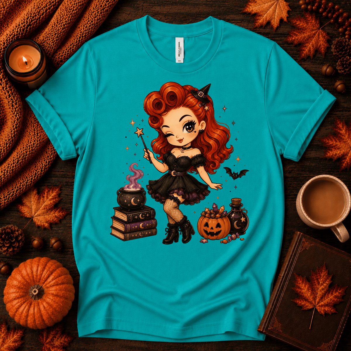 Witchy Wendy halloween pinup graphic t-shirt cozy flat lay in heather sea green.