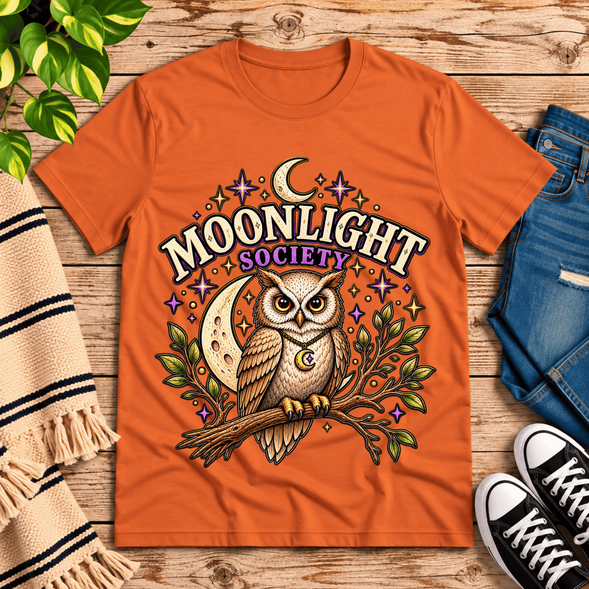 Moonlight Society cute celestial graphic t-shirt cozy flat lay in burnt orange.
