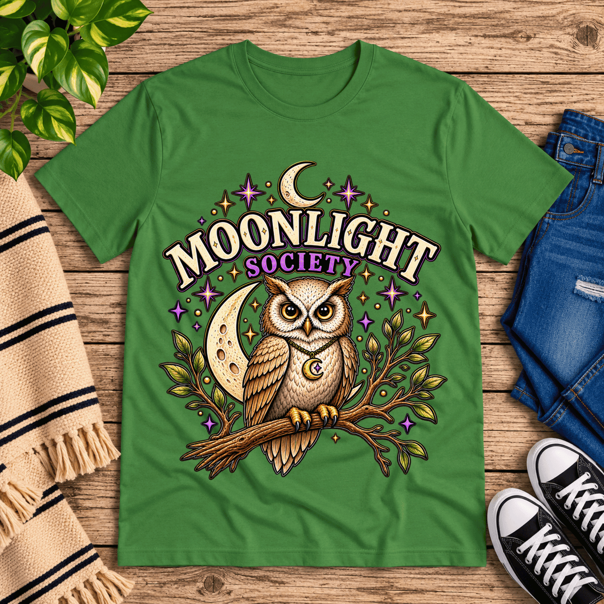 Moonlight Society cute celestial graphic t-shirt cozy flat lay in leaf.