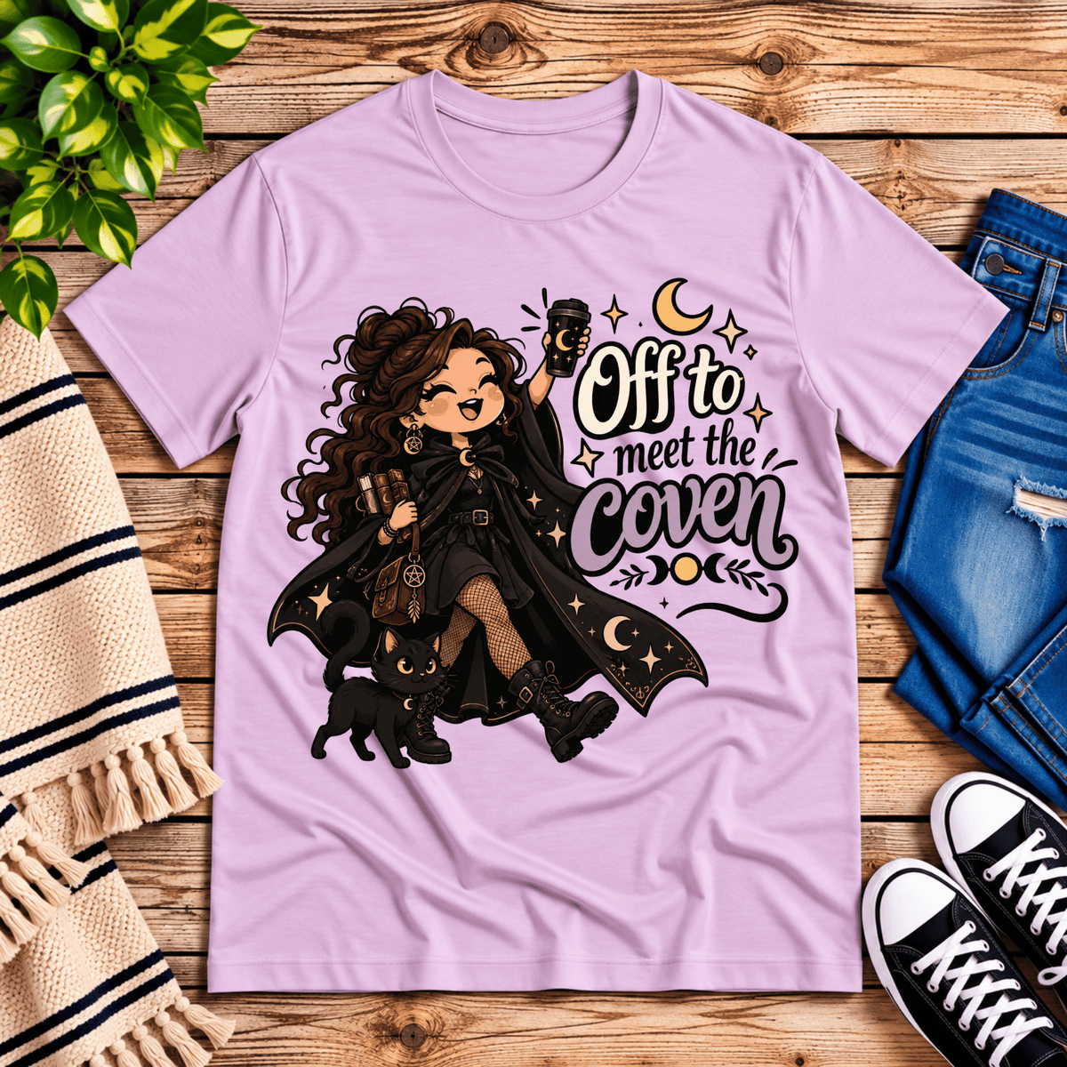 Off to Meet the Coven witchy celestial graphic t-shirt cozy flat lay in lilac.