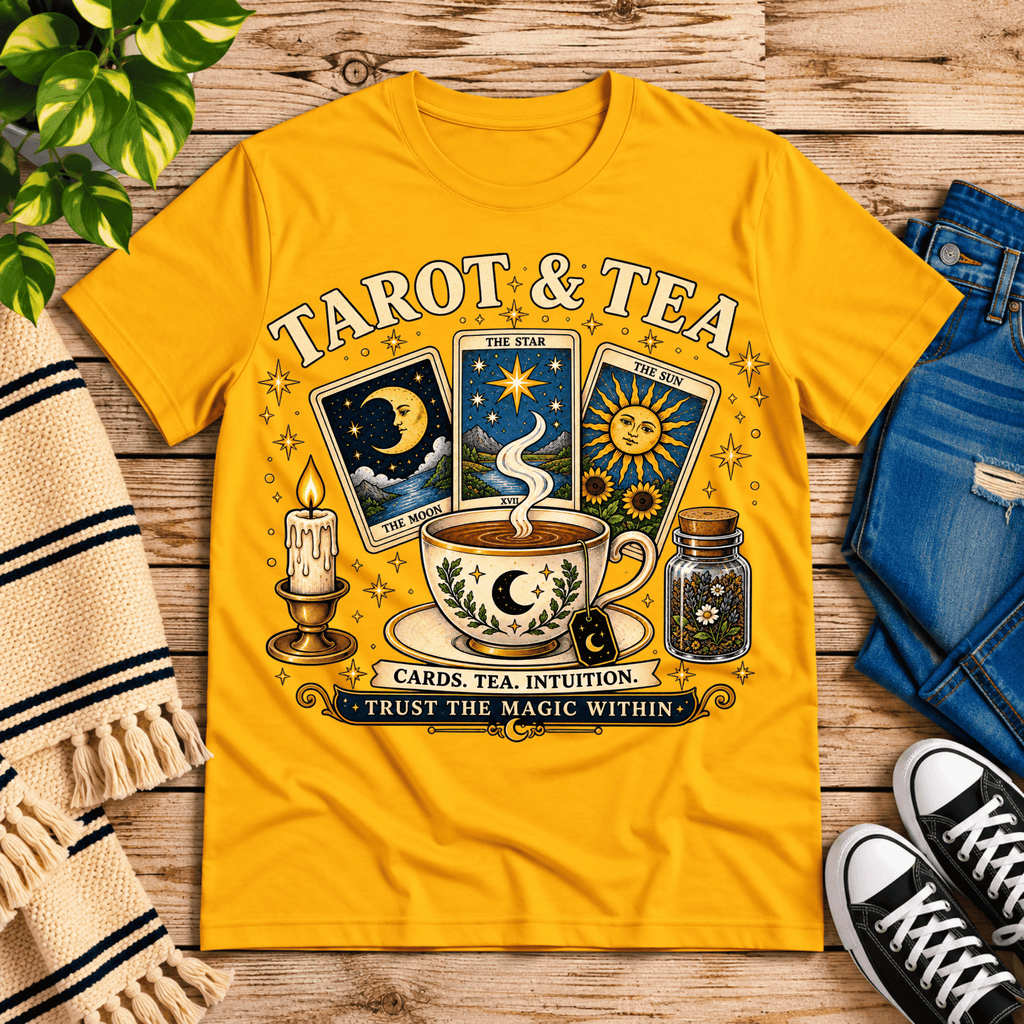 Tarot & Tea tarot card graphic t-shirt cozy flat lay in gold.