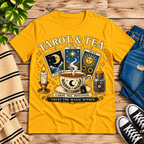 Tarot & Tea tarot card graphic t-shirt cozy flat lay in gold.
