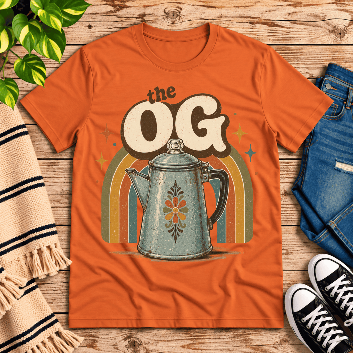 The OG retro coffee graphic t-shirt cozy flat lay in burnt orange.