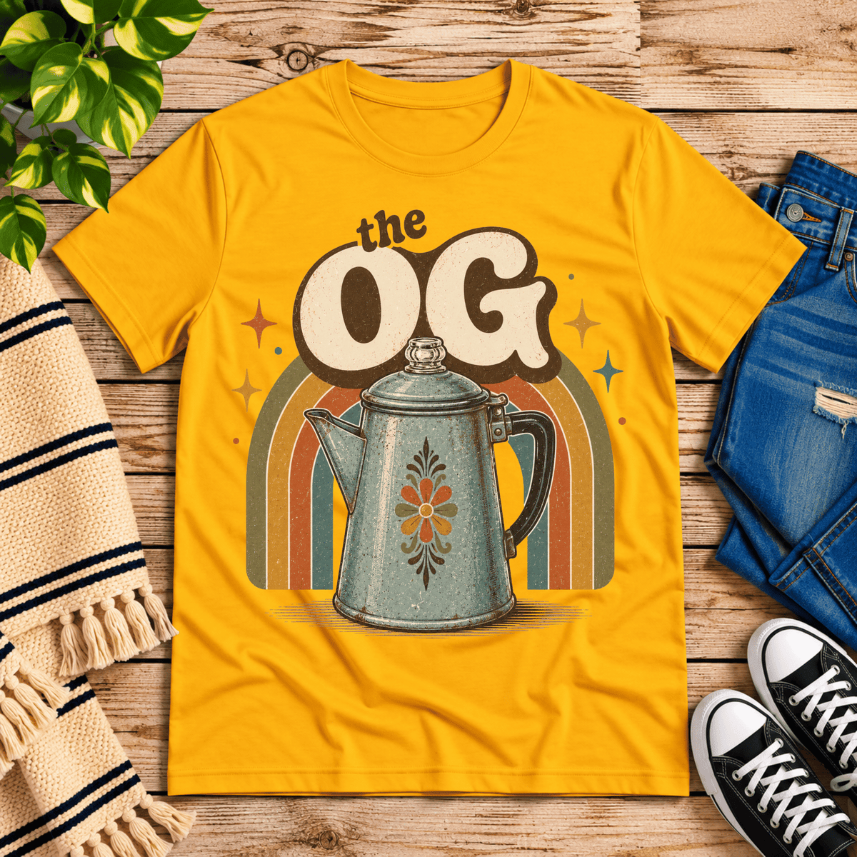 The OG retro coffee graphic t-shirt cozy flat lay in gold.