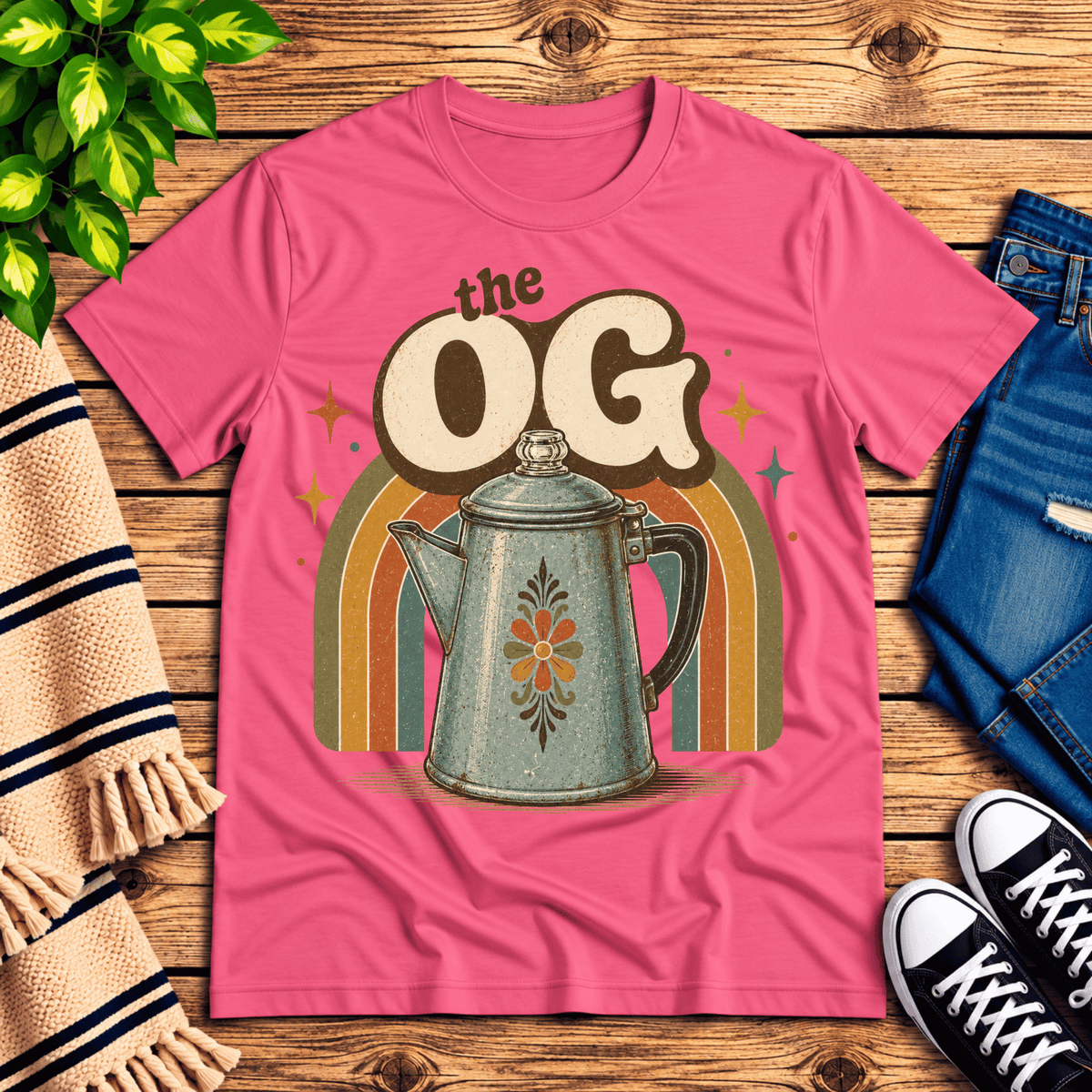 The OG retro coffee graphic t-shirt cozy flat lay in charity pink.