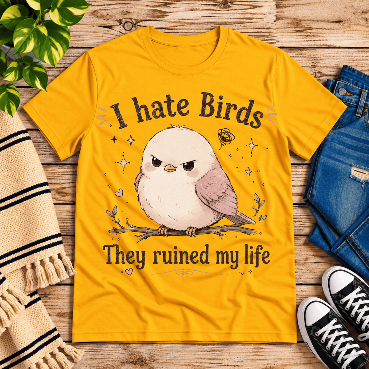 I Hate Birds cute animal graphic t-shirt cozy flat lay in gold.