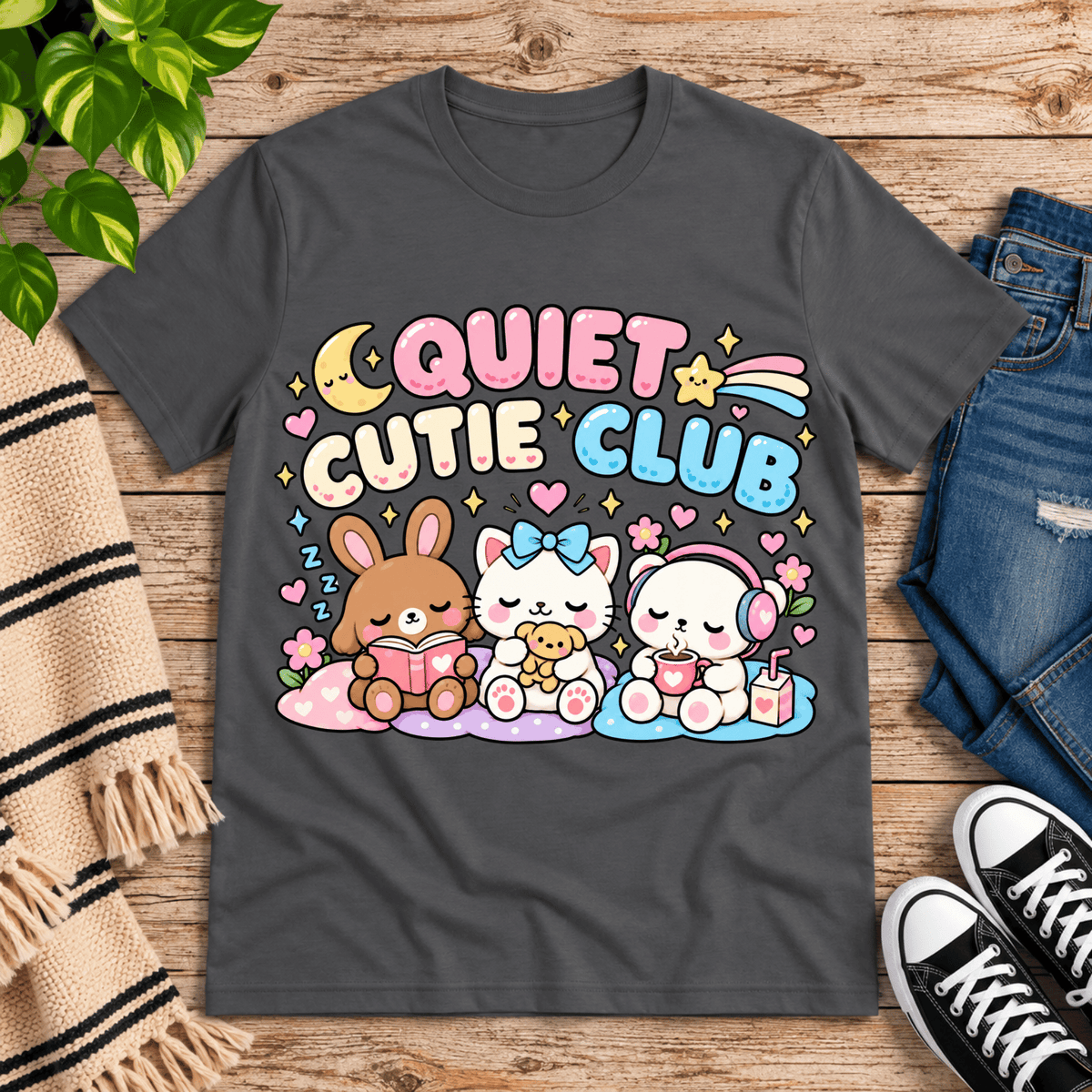 Quiet Cutie Club cute animal graphic t-shirt cozy flat lay in asphalt.