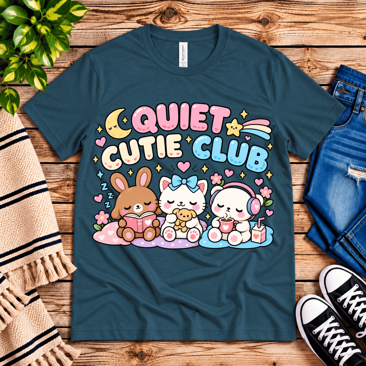 Quiet Cutie Club cute animal graphic t-shirt cozy flat lay in deep teal.