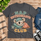 Nap Enthusiasts Club cute animal graphic t-shirt cozy flat lay in asphalt.