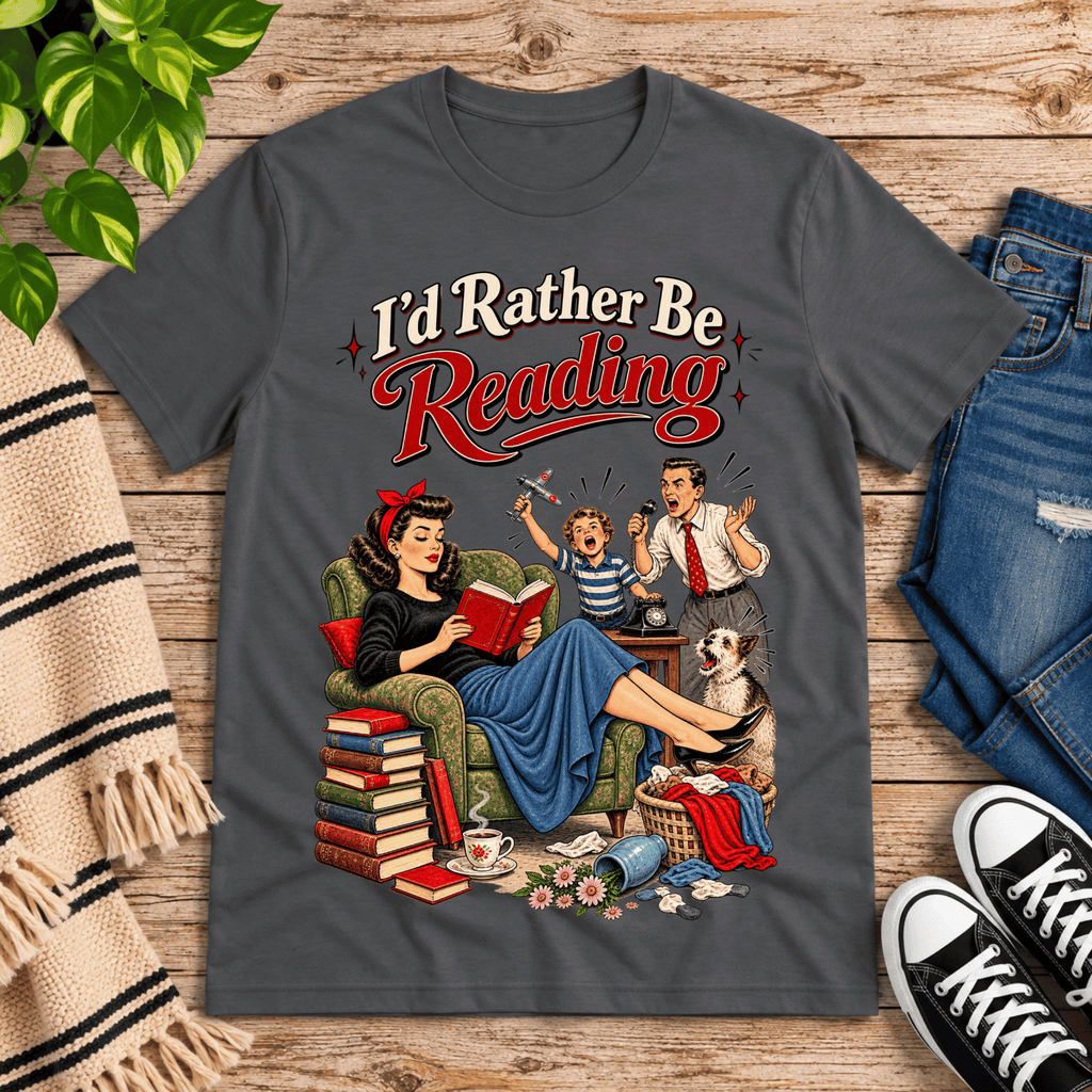 A cozy flat lay mockup of I'd Rather Be retro book graphic t-shirt in asphalt.
