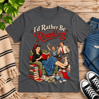A cozy flat lay mockup of I'd Rather Be retro book graphic t-shirt in asphalt.