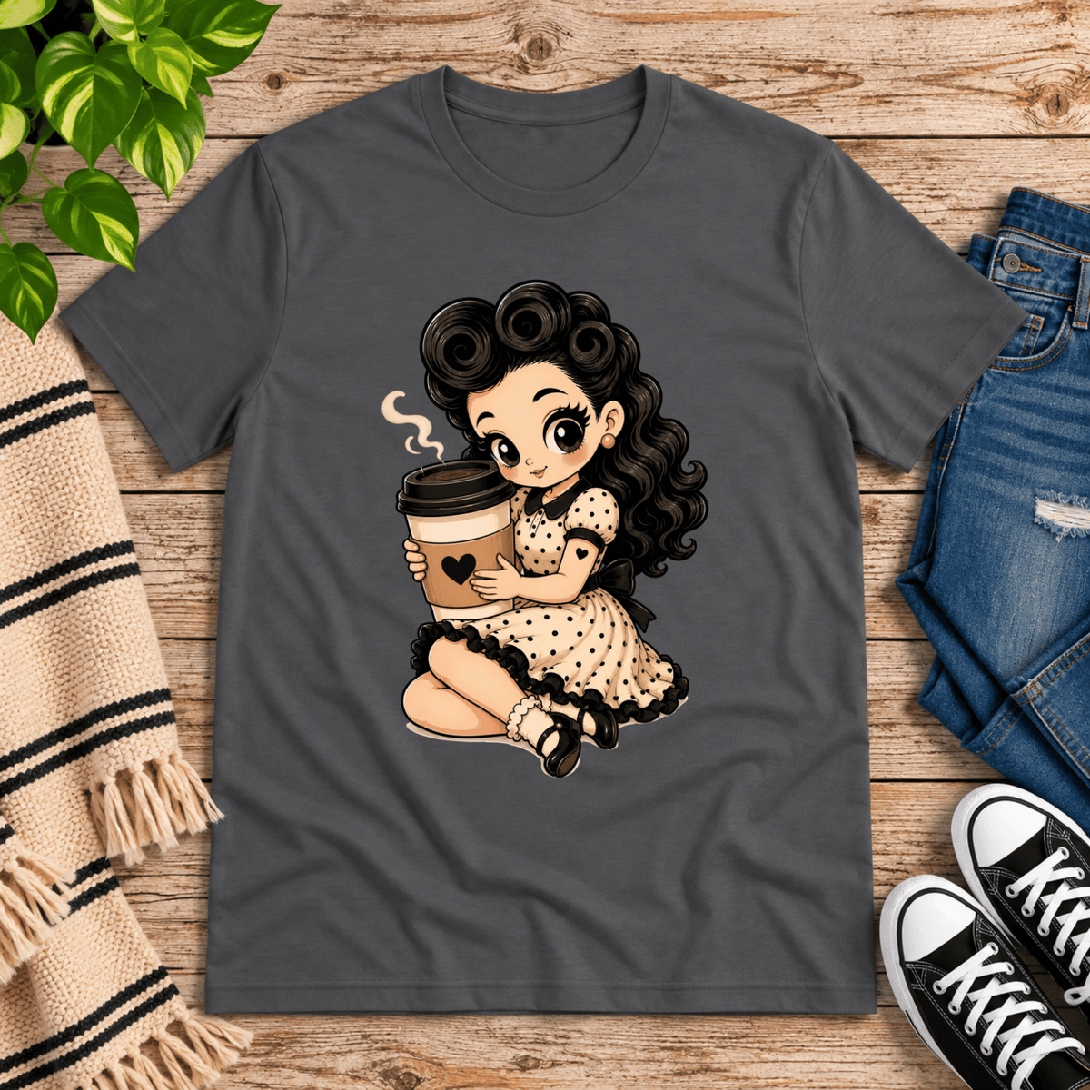 Coffee Clara pinup graphic t-shirt cozy flat lay in asphalt.