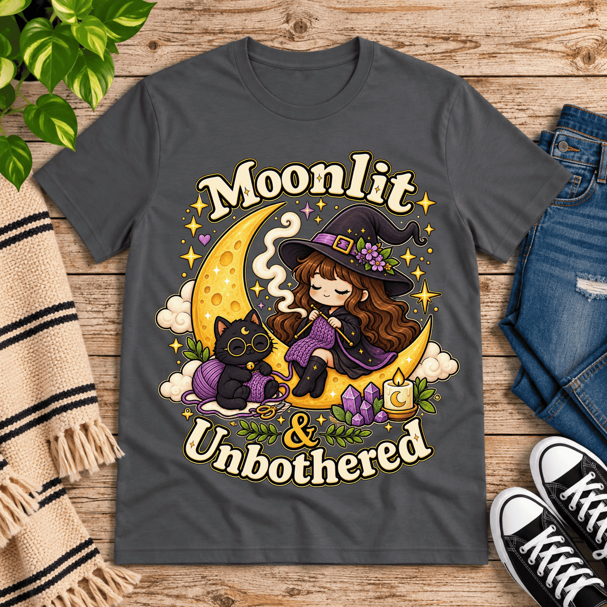 Moonlit & Unbothered cute witchy graphic t-shirt cozy flat lay in asphalt.