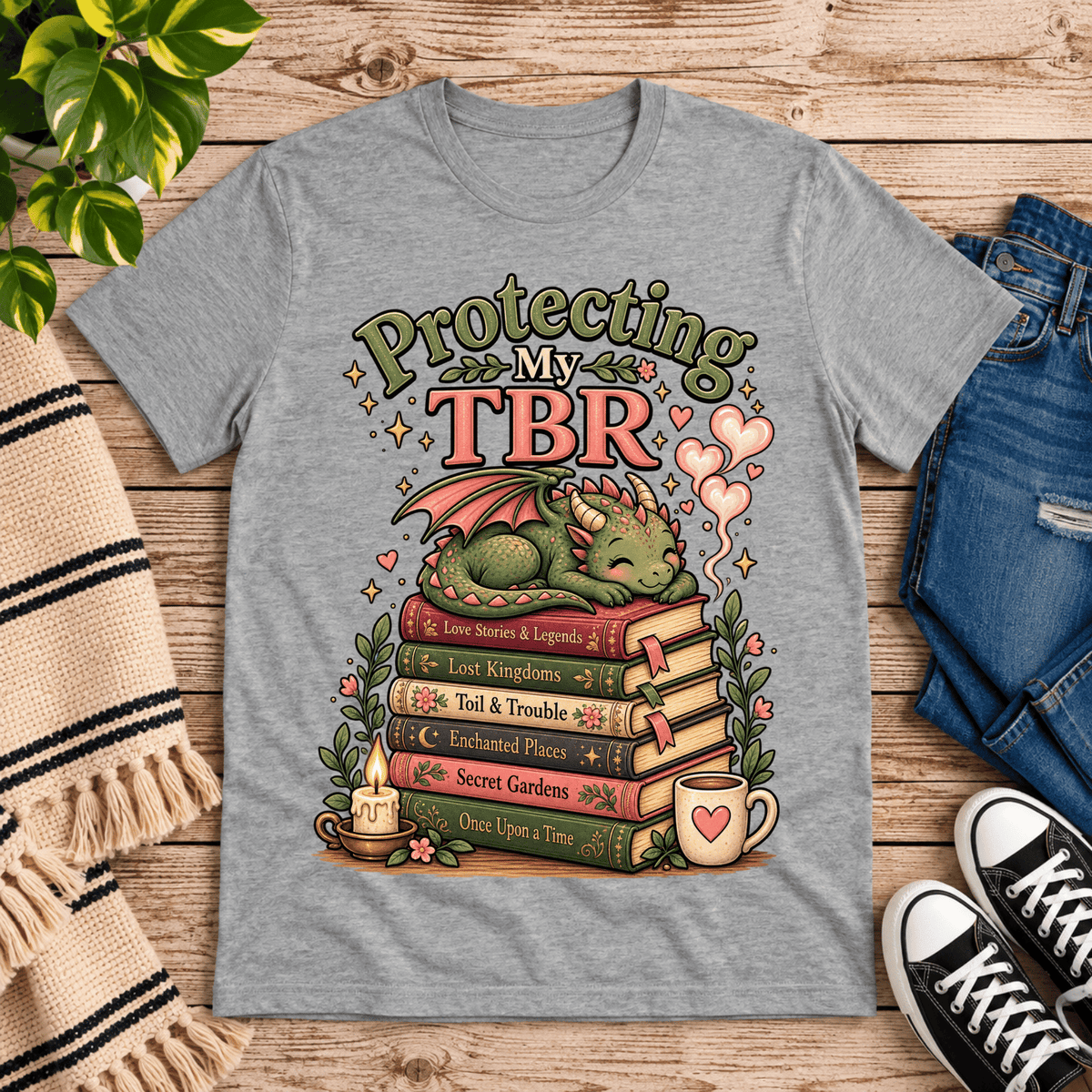 Protecting My TBR cute book graphic t-shirt cozy flat lay in athletic heather.