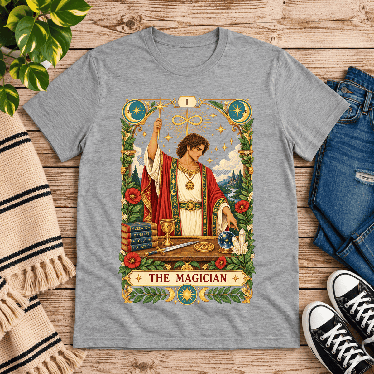 The Magician tarot card graphic t-shirt cozy flat lay in athletic heather.