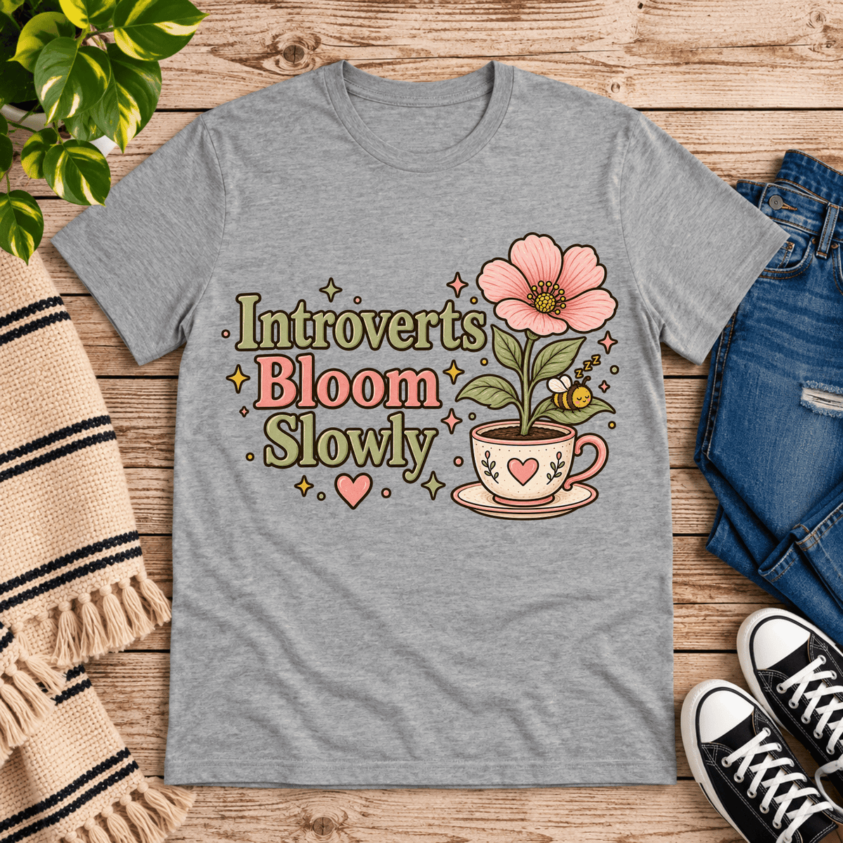 Introverts Bloom Slowly cute plant graphic t-shirt cozy flat lay in athletic heather.