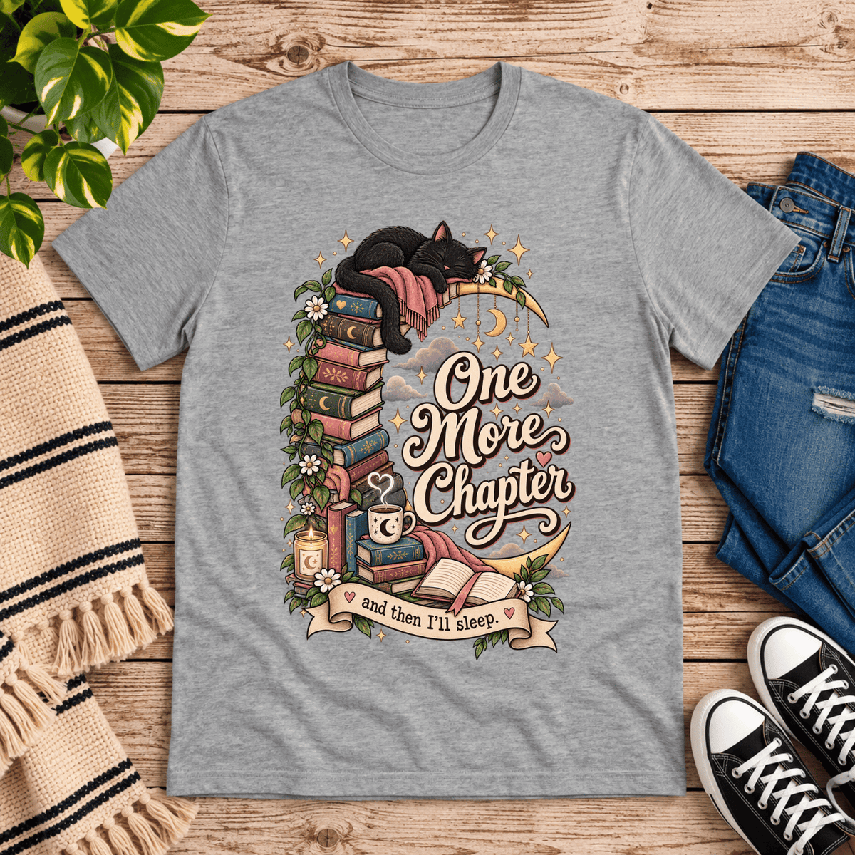 One More Chapter cute book graphic t-shirt cozy flat lay in athletic heather.