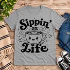 Sippin' on Life cute coffee graphic t-shirt cozy flat lay in athletic heather.