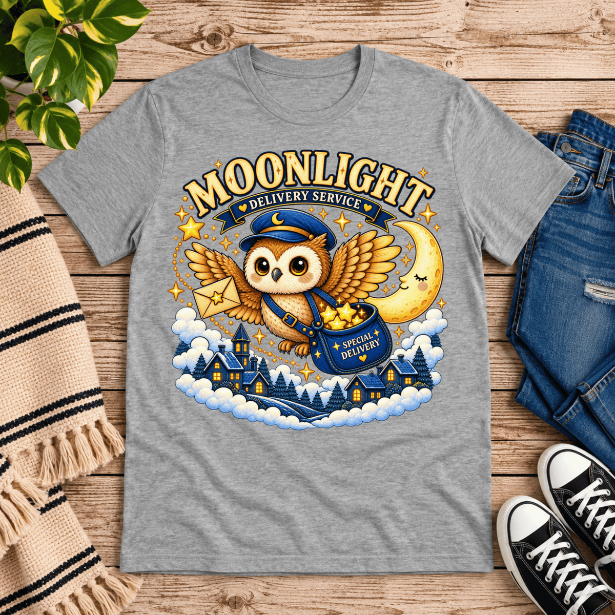 Moonlight Delivery cute animal graphic t-shirt cozy flat lay in athletic heather.