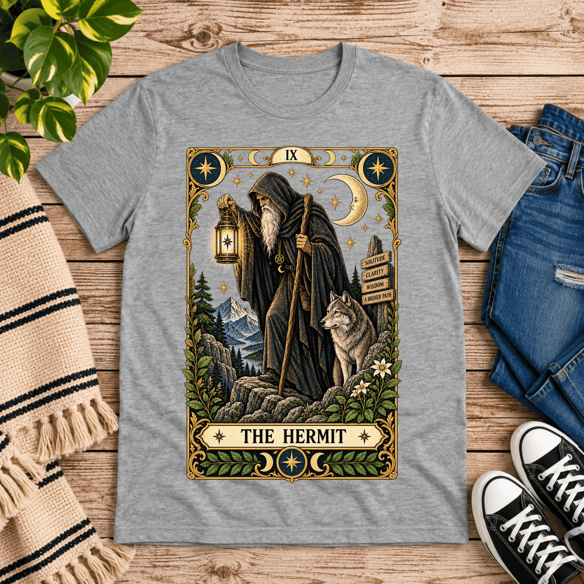 The Hermit tarot card graphic t-shirt cozy flat lay in athletic heather.