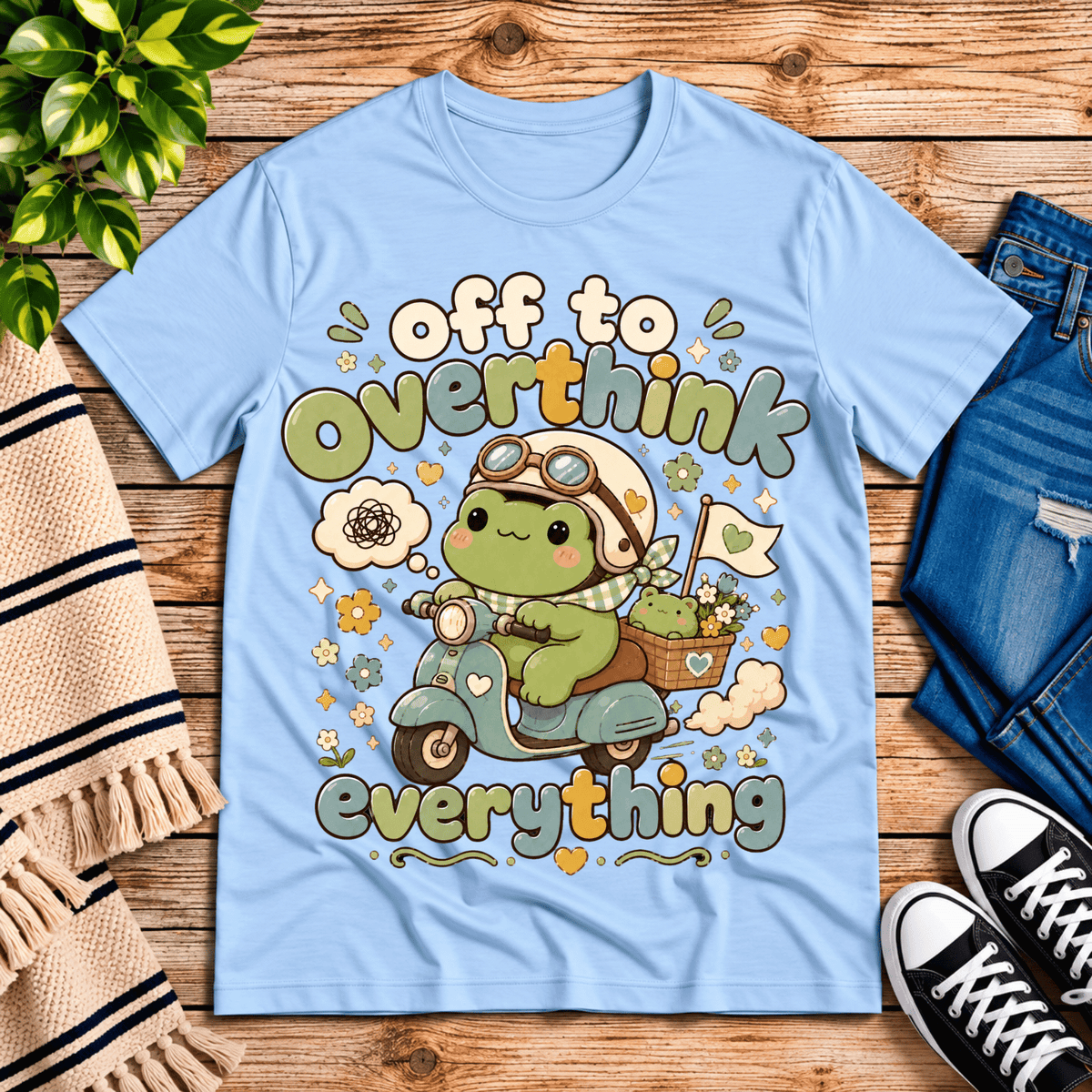Overthink Frog cute animal graphic t-shirt cozy flat lay in baby blue.