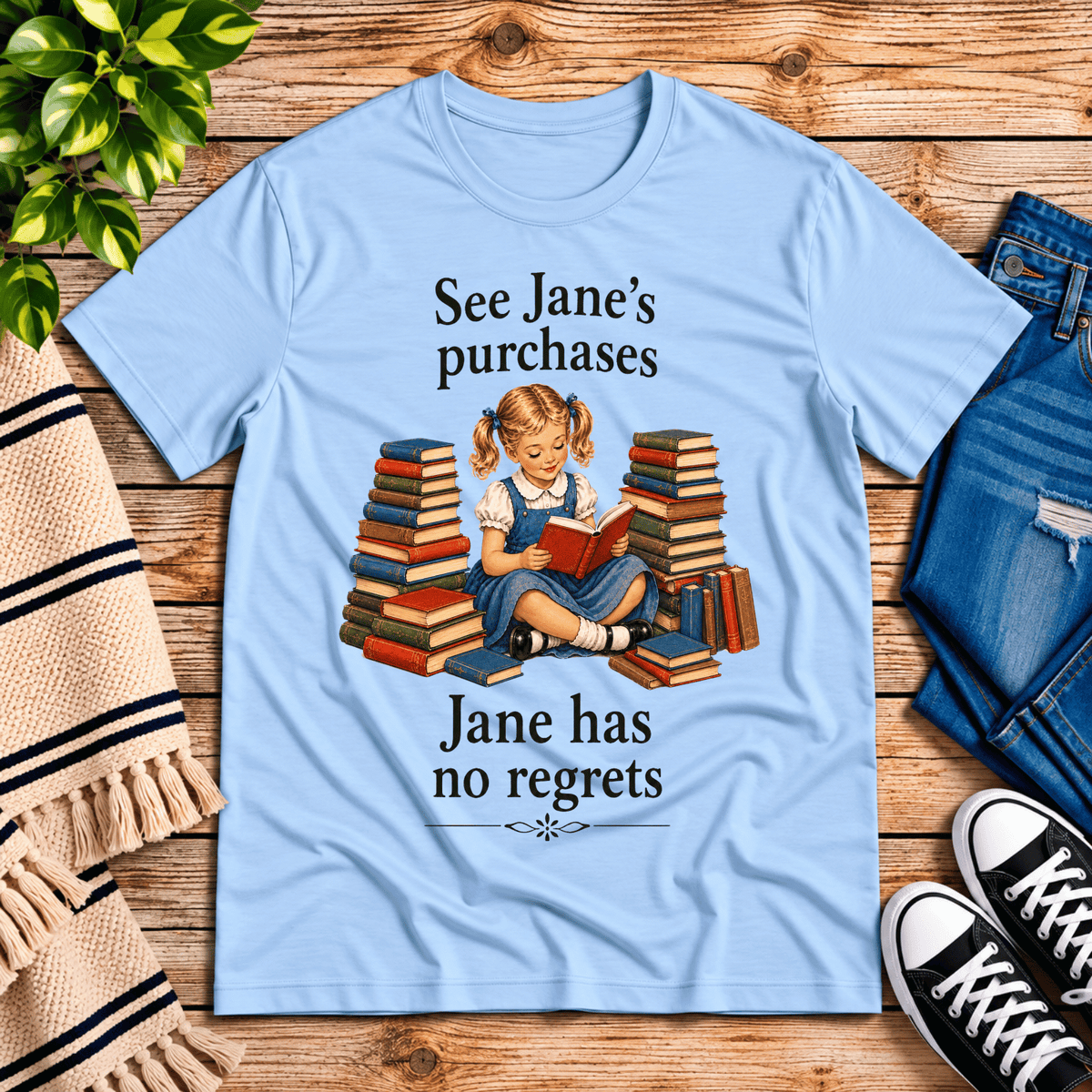 See Jane's Purchases vintage book graphic t-shirt cozy flat lay in baby blue.