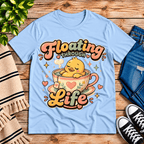 Floating Through Life cute animal graphic t-shirt cozy flat lay in baby blue.