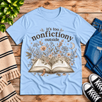 Nonfictiony whimsical book graphic t-shirt cozy flat lay in baby blue.