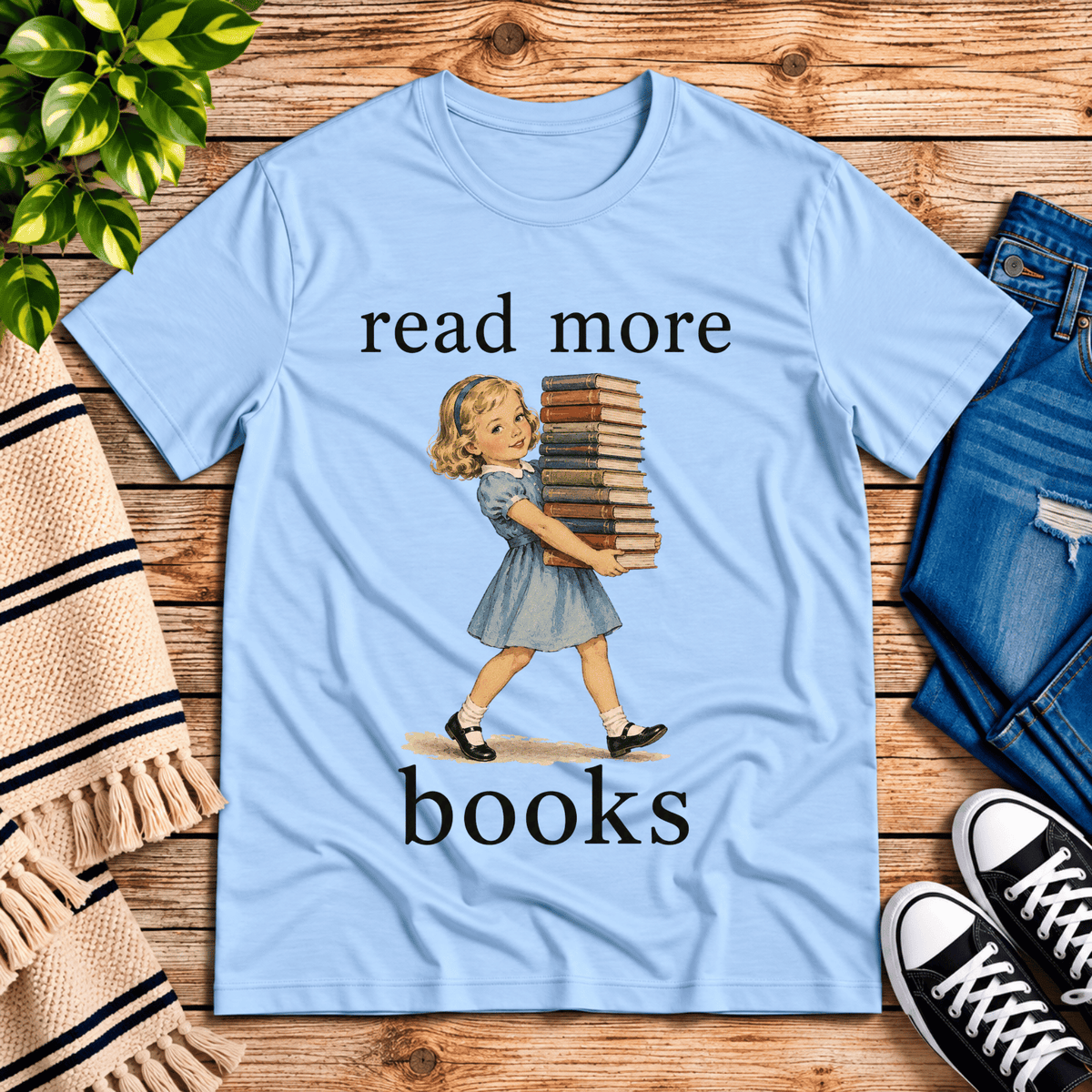 Read More vintage book graphic t-shirt cozy flat lay in baby blue.