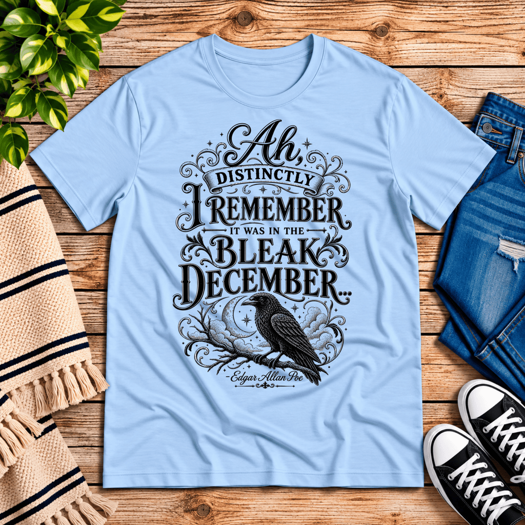 Bleak December book quote graphic t-shirt cozy flat lay in baby blue.