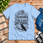 Bleak December book quote graphic t-shirt cozy flat lay in baby blue.