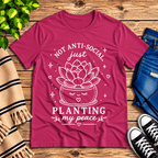 Planting My Peace cute plant graphic t-shirt cozy flat lay in berry.