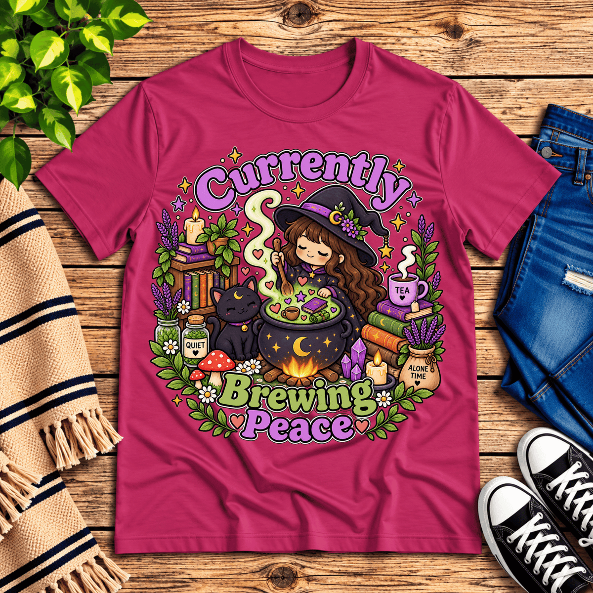 Currently Brewing cute witchy graphic t-shirt cozy flat lay in berry.