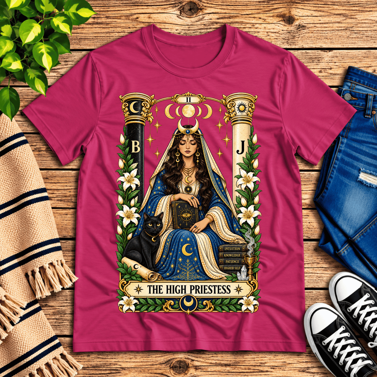 The High Priestess tarot card graphic t-shirt cozy flat lay in berry.