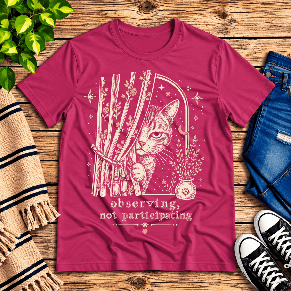 Cat Observing cute animal graphic t-shirt cozy flat lay in charity pink.