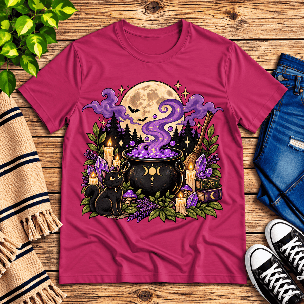 The cauldron cute celestial graphic t-shirt cozy flat lay in berry.