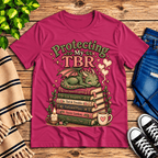 Protecting My TBR cute book graphic t-shirt cozy flat lay in berry.