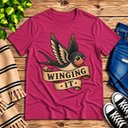 Winging It cute animal graphic t-shirt cozy flat lay in berry.