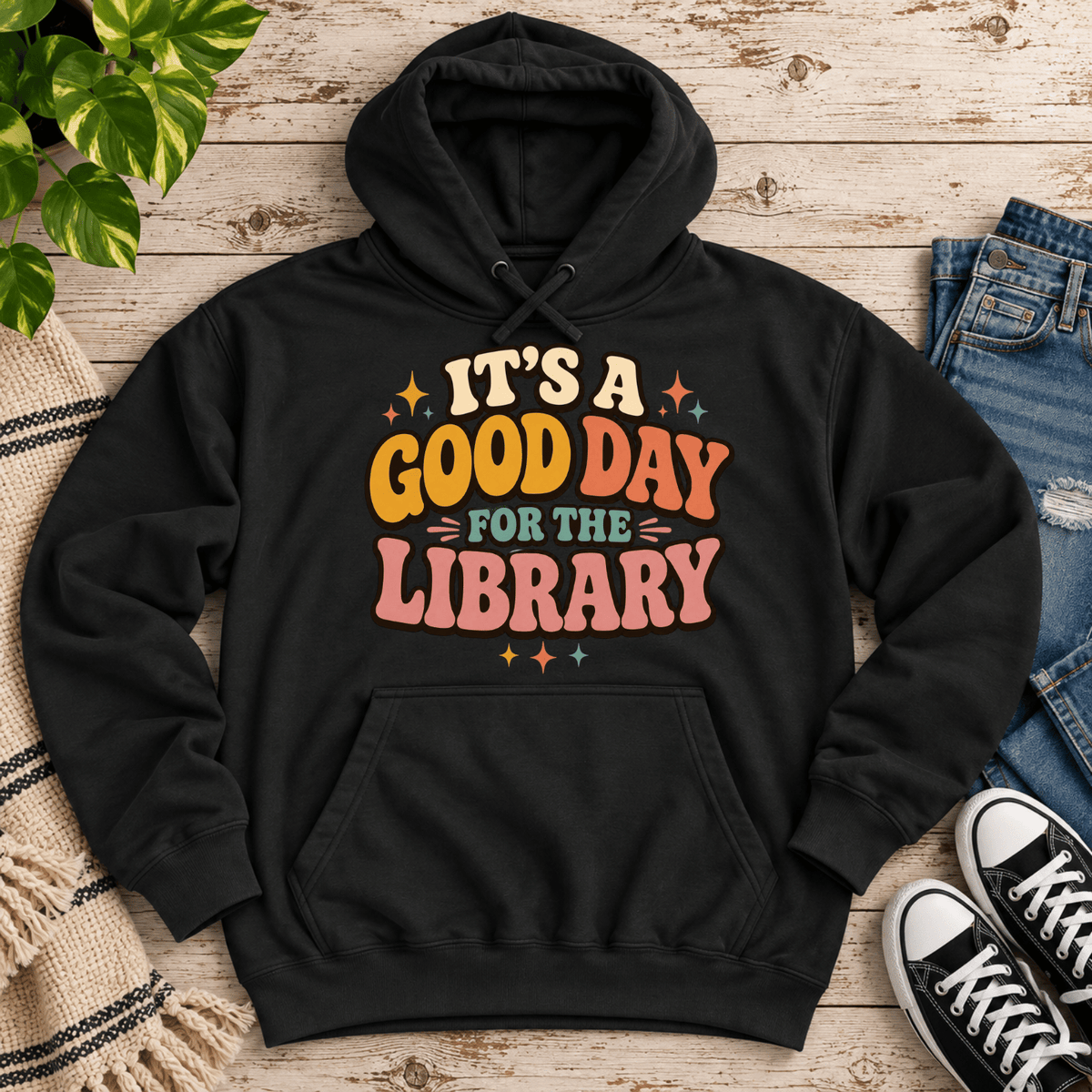 It's A Good Day cute book graphic hoodie cozy flat lay in black.