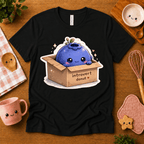 Blueberry Box cute food graphic t-shirt in cozy flat lay in black.
