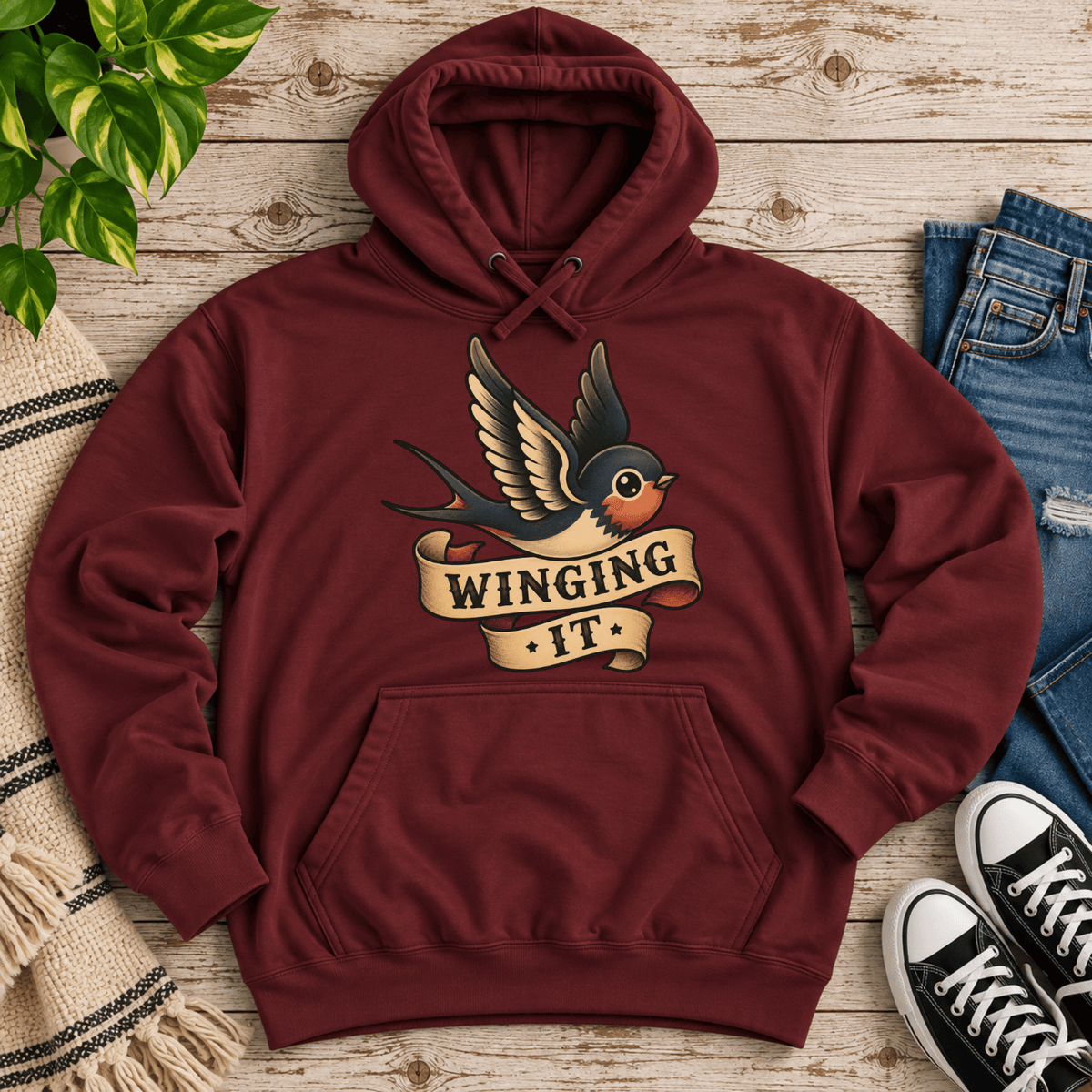 Winging It cute animal graphic hoodie cozy flat lay in burgundy.