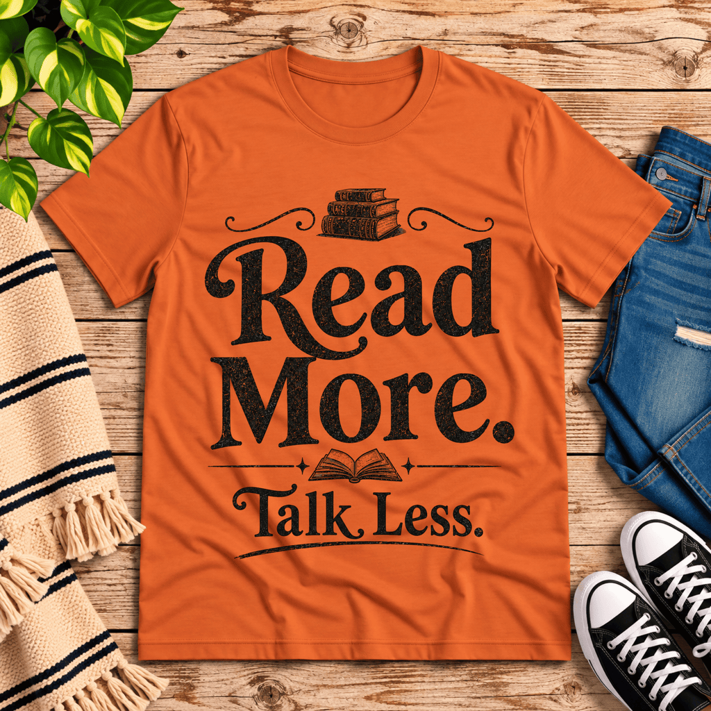 Talk Less funny book graphic t-shirt cozy flat lay in burnt orange.