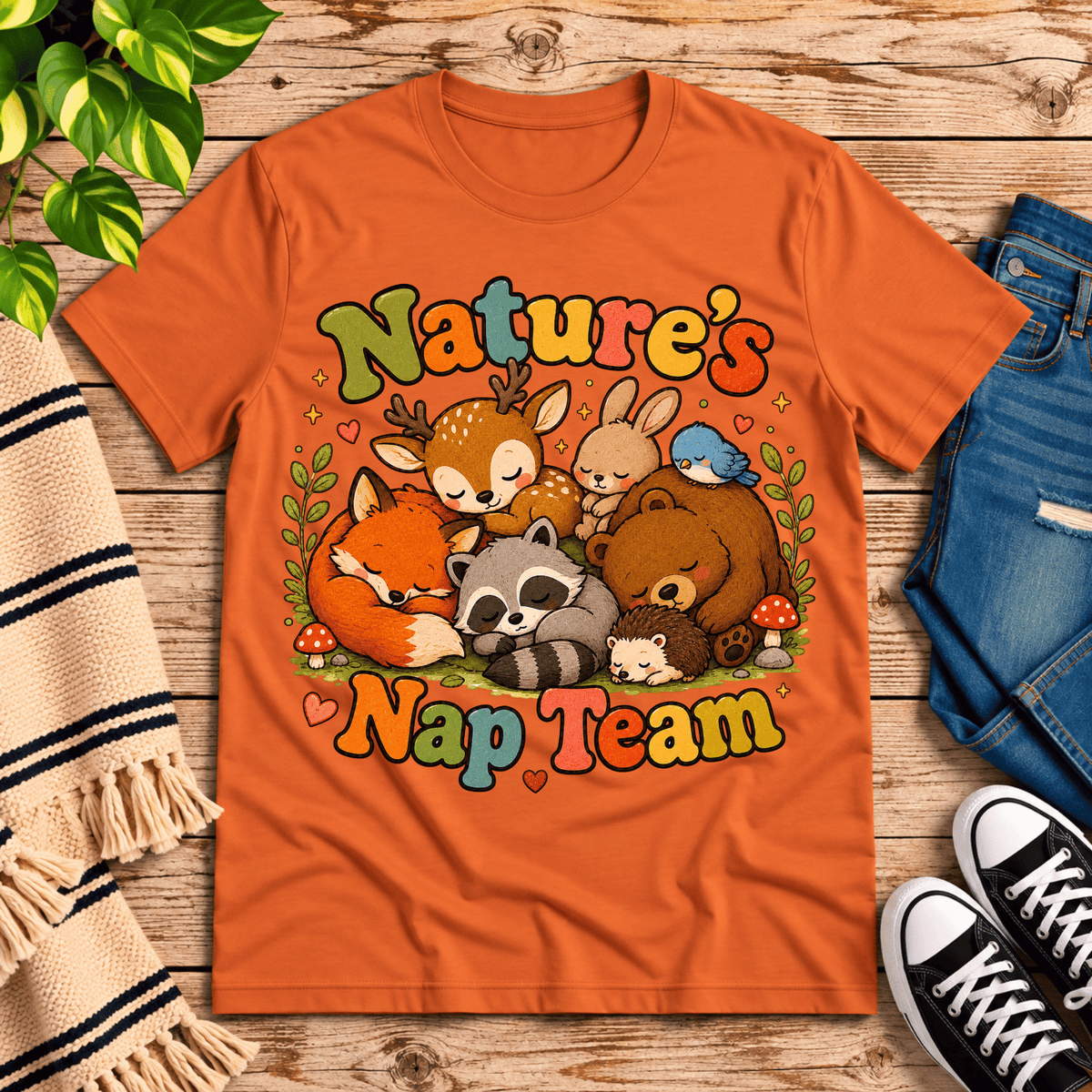 Nature's Nap Team cute animal graphic t-shirt cozy flat lay in burnt orange.