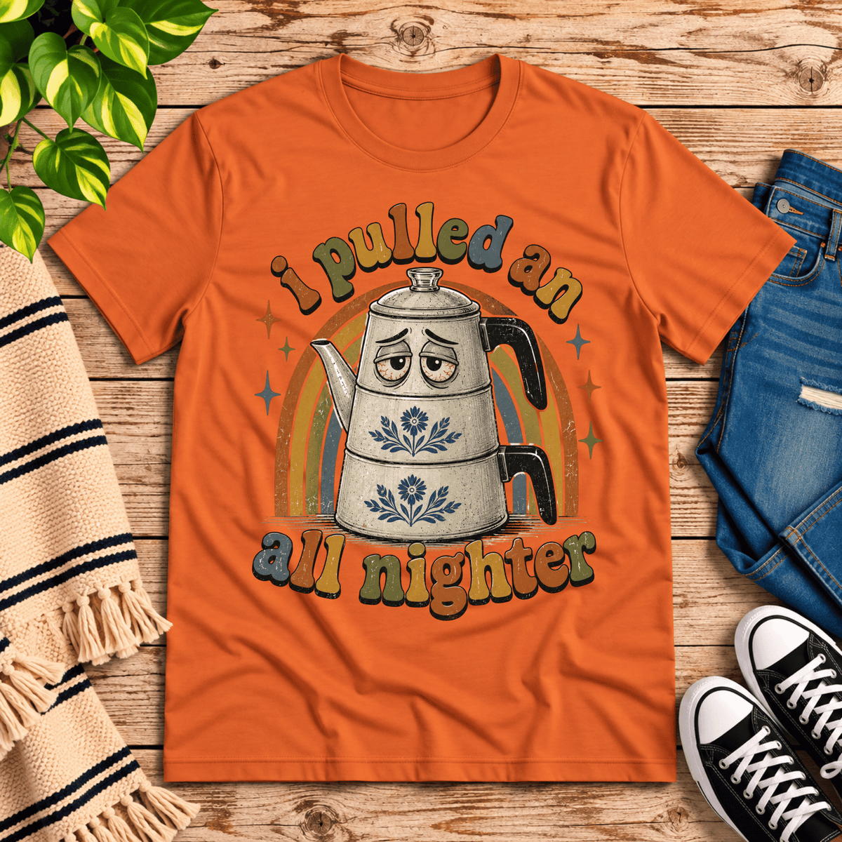 All Nighter cute coffee graphic t-shirt cozy flat lay in burnt orange.